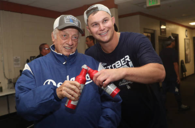 Former Los Angeles Dodgers manager Tommy Lasorda with Joc Pederson to celebrate clinching the 2019 NL West