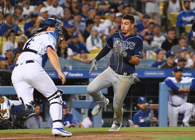 Los Angeles Dodgers catcher Will Smith waits for a throw at home plate