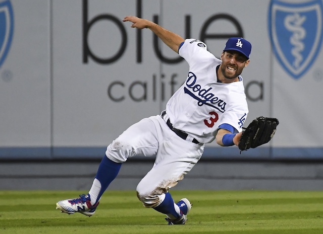 Los Angeles Dodgers utility player Chris Taylor makes a sliding catch during Game 1 of the 2019 NLDS