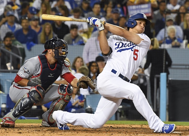 Los Angeles Dodgers shortstop Corey Seager hits a single during Game 1 of the 2019 NLDS