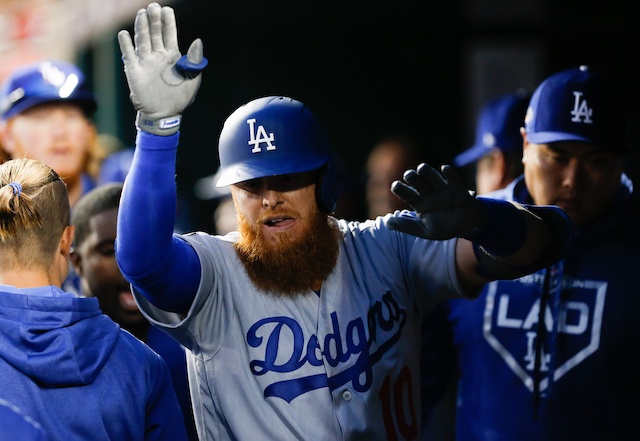 Los Angeles Dodgers third baseman Justin Turner is congratulated after hitting a home run in Game 4 of the 2019 NLDS