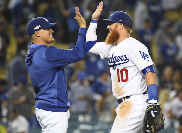 Los Angeles Dodgers teammates Kiké Hernandez and Justin Turner celebrate after winning Game 1 of the 2019 NLDS