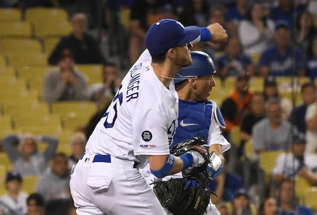 Los Angeles Dodgers All-Star Cody Bellinger throws out San Francisco Giants catcher Stephen Vogt