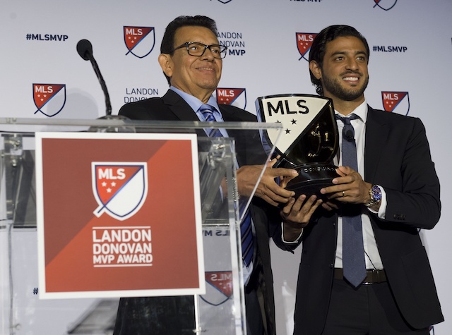 Former Los Angeles Dodgers pitcher Fernando Valenzuela presents the MLS MVP trophy to Los Angeles FC forward Carlos Vela