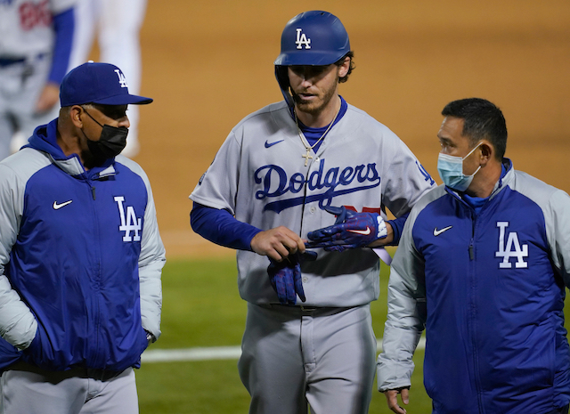 Cody Bellinger, Dave Roberts, Dodgers trainer Yosuke "Possum" Nakajima