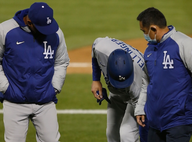 Cody Bellinger, Dave Roberts, Dodgers trainer, Yosuke “Possum” Nakajima