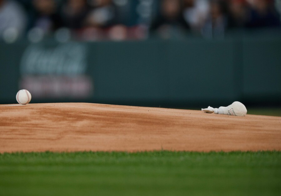 Baseball, rosin bag, pitcher's mound