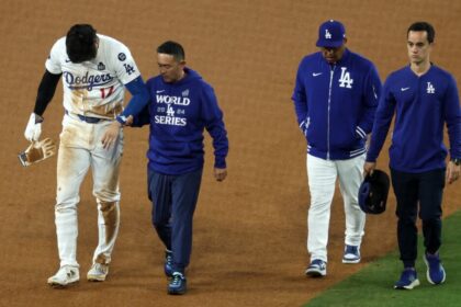 Shohei Ohtani, Dodgers trainer Yosuke "Possum" Nakajima, Dave Roberts, Will Ireton, 2024 World Series