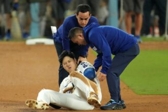 Shohei Ohtani, Dodgers trainer Yosuke "Possum" Nakajima, Will Ireton, 2024 World Series