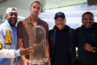 Jaleel White, Jack Flaherty, Dave Roberts, 2024 World Series trophy