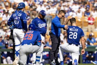 Bobby Miller, Dodgers trainer Thomas Albert, Hunter Feduccia, Dave Roberts, Michael Busch, 2025 Spring Training