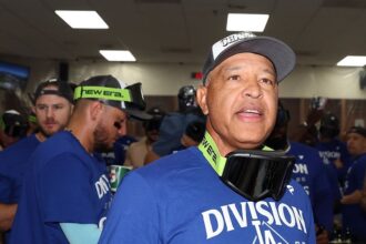 Dave Roberts, Miguel Rojas, Max Muncy, NL West celebration