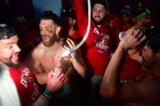 Kyle Schwarber, Bryce Harper, Phillies NL East celebration, Roberto Clemente Day