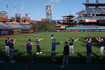 Alex Vesia, Clayton Kershaw, Tanner Scott, Kirby Yates, Jack Dreyer, trainer Eric Yavarone, Dodgers pitchers stretching, 2025 NLDS