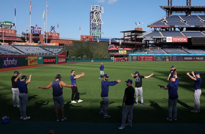 Alex Vesia, Clayton Kershaw, Tanner Scott, Kirby Yates, Jack Dreyer, trainer Eric Yavarone, Dodgers pitchers stretching, 2025 NLDS