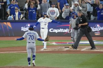 Justin Wrobleski, Andrés Giménez, Will Smith, umpire Jordan Baker, 2025 World Series