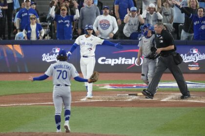 Justin Wrobleski, Andrés Giménez, Will Smith, umpire Jordan Baker, 2025 World Series