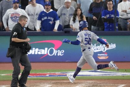 Mookie Betts, umpire Jordan Baker, 2025 World Series