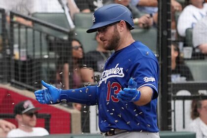 Max Muncy, sunflower seeds celebration, alternate blue Dodgers road jersey