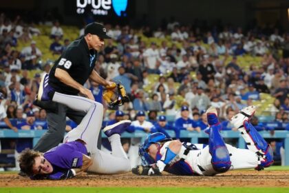 Dalton Rushing, Cole Carrigg, umpire Dan Iassogna