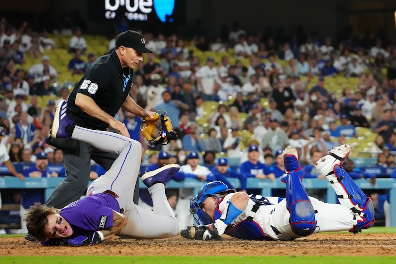 Dalton Rushing, Cole Carrigg, umpire Dan Iassogna