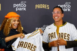 Padres owners Kwanza Jones and José E. Feliciano